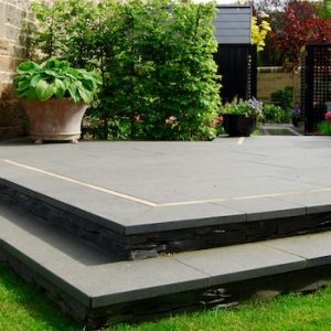 Black basalt paving with clashach inlay, built by Water Gems, designed by Carolyn Grohmann